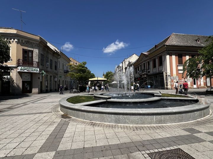 A round fountain in the pedestrian zone of Sombor on a sunny day